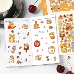 Close-up of decorative red panda stickers applied to a notebook with 2 sheets set