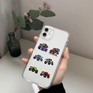 Close-up of a clear iPhone case featuring colorful monster truck graphics held by hand