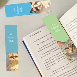 Artistic cat bookmarks set featuring 'YOU PAWSED HERE' text on an open vintage book