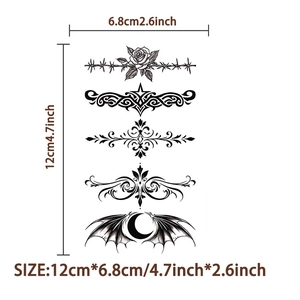 Macro shot of black tribal tattoo stickers with rose and moon designs and size details