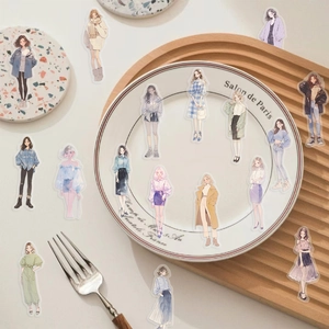 Flat lay of transparent PET stickers featuring stylish female fashion illustrations