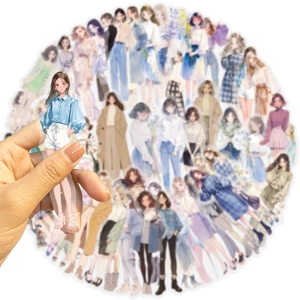 Detail showing various clear PET fashion girl stickers used for journal decoration