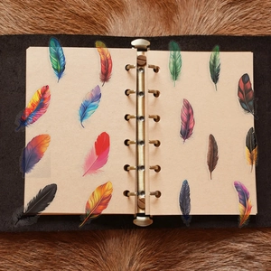 Vintage ring binder journal featuring colorful feather PET stickers on textured paper