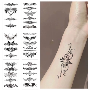 Detail of waterproof black totem tattoo stickers showing diverse gothic butterfly designs