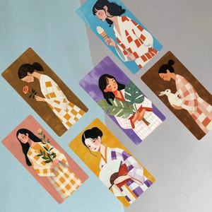 Detail of artistic cartoon girl bookmarks with elegant illustration and textured paper finish
