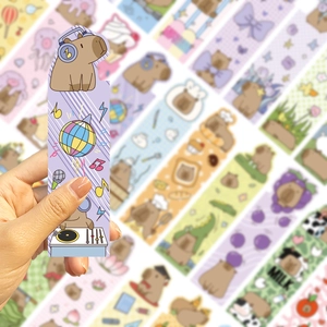 Close-up of a cartoon capybara DJ bookmark with vibrant disco ball and music notes details