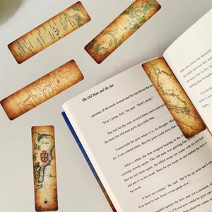 Detailed view of vintage kraft paper bookmarks with retro nautical world map prints