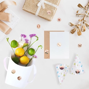 Close-up of vintage floral and animal stickers on marble surface for gift decoration