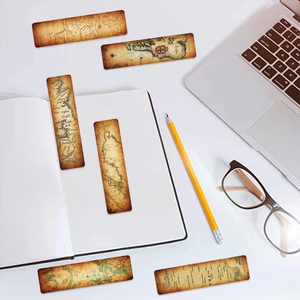 Set of 6 vintage nautical map bookmarks on a desk with a laptop and glasses