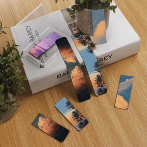 Detail of landscape magnetic bookmarks with sunset scenery and clear storage box