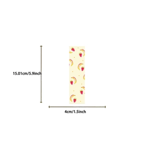 Detail view of rectangular Coquette bookmark showing strawberry patterns and dimensions