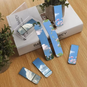 Set of 6 magnetic bookmarks featuring landscape themes like blue sky and flowers