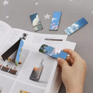 Close-up of scenic landscape magnetic bookmarks used on a magazine page