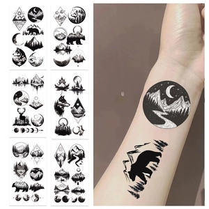Detail of waterproof outdoor camping temporary tattoos with bear and wolf designs