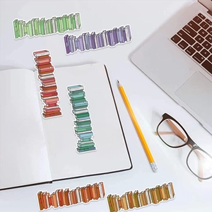 Detailed view of six colorful cartoon book stickers on a clean desk with office stationery