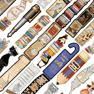 Macro detail of vintage paper bookmarks featuring antique books and inkwell illustrations