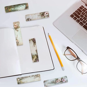 Macro shot of vintage floral bookmarks with botanical patterns on a desk workspace
