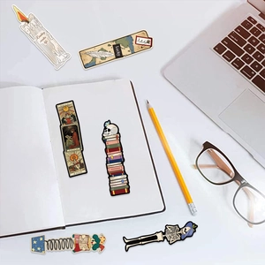 Close-up of vintage reading-themed bookmarks with skull, tarot and fantasy motifs
