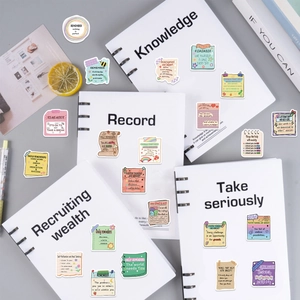 Close-up of motivational mental health stickers on notebook with pastel colors