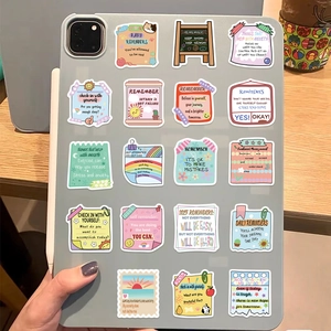 50pcs Mental Health Stickers with motivational quotes on a laptop and wooden desk