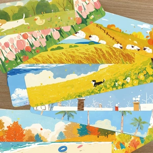 Dettaglio di vari segnalibri artistici con paesaggi primaverili su piano in legno