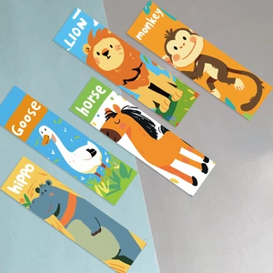 Detailed flat lay of cute animal bookmarks featuring a lion, monkey, and goose for DIY crafts