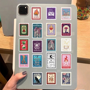 Set of 50 book trope postage stamp stickers on a blue tablet case for DIY decoration
