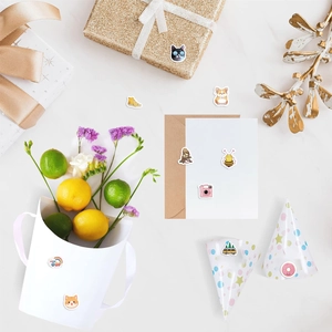 Close-up of cute animal and lifestyle stickers on gift boxes and greeting cards