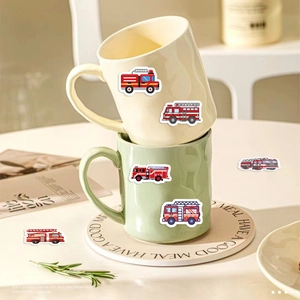 Detail of fire truck stickers on ceramic mugs showing six different cartoon patterns