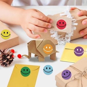 Colorful smiley face stickers on craft box and envelopes for gift decoration