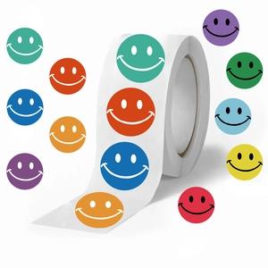 Macro view of assorted colorful smiley face stickers in a roll for DIY decoration