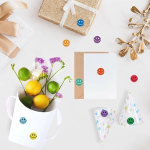 Close-up of colorful smiley face round stickers used for gift boxes and envelope sealing
