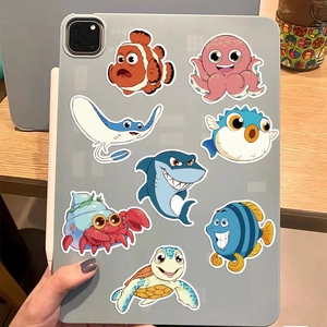 Close-up of ocean animal stickers on an iPad back for DIY notebook decoration