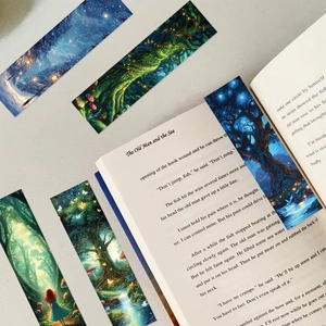Artistic forest paper bookmark placed inside a classic book for a cozy reading aesthetic