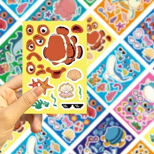 Detail of DIY ocean animal sticker featuring a clownfish with various facial expressions