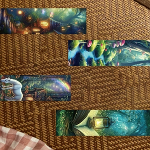 Detailed view of forest-themed bookmarks with unicorns and mushrooms on a rustic texture