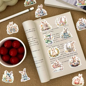 Waterproof Easter bunny stickers displayed on open book with floral patterns