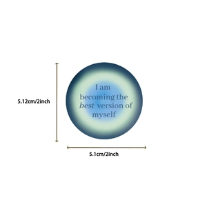 Detail showing a 2-inch waterproof sticker with motivational quote and teal gradient effect
