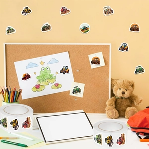 Detail of tractor and construction vehicle stickers roll on a cozy creative desk