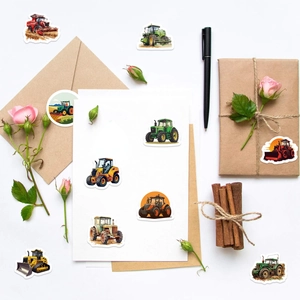 Close-up of colorful cartoon tractor stickers on gift boxes and envelopes for decoration