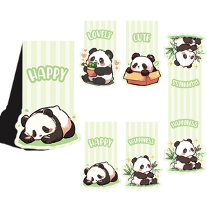 Detailed flat lay of cute panda magnetic bookmarks with lovely green stripe patterns