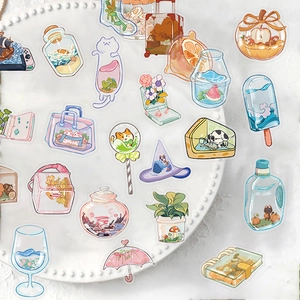 Set of 50 waterproof PET stickers with hand-drawn aesthetic icons on a white ceramic tray