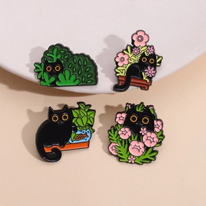 Cute black cat enamel pins set featuring floral plants and playful cartoon animal designs