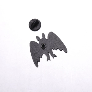 Detailed back view of bat enamel pin featuring matte black finish and rubber clutch backing