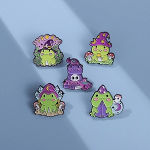 Lot de 5 broches émaillées grenouille magicienne avec chapeaux de sorcière et grimoires