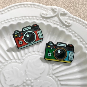 Retro camera enamel pins in vibrant metal lacquer finish for backpacks and clothing