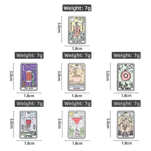 Detail view of 7 tarot-themed enamel pins including coffee, pizza, and wine motifs