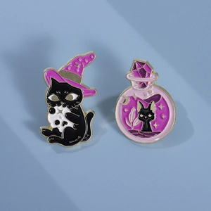 Detail of black cat wizard enamel pin set with purple witch hat and magic potion design