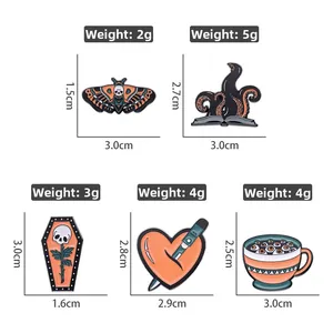 Detailed view of Gothic butterfly and skull enamel pins set with precise dimensions
