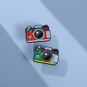 Retro camera enamel pins set with vintage red and colorful designs on light blue background